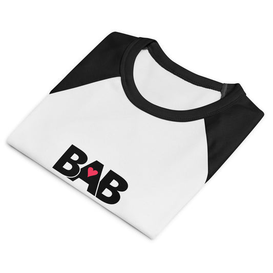 BAB Badass raglan baby tee in black and white with red heart graphic – front folded view